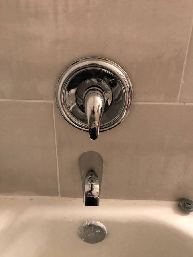 picture ofnewly installed bathtub hot and cold handle and water spout