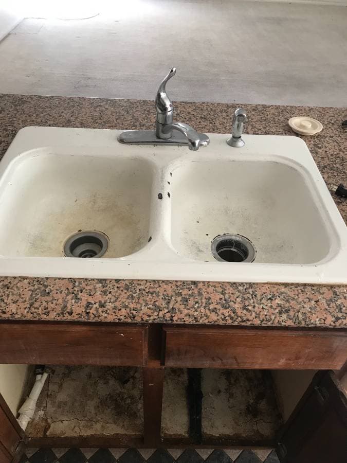 picture of an old sink ready to be replaced