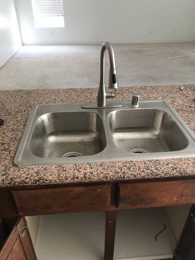 picture of a newly installed stainless steel sink